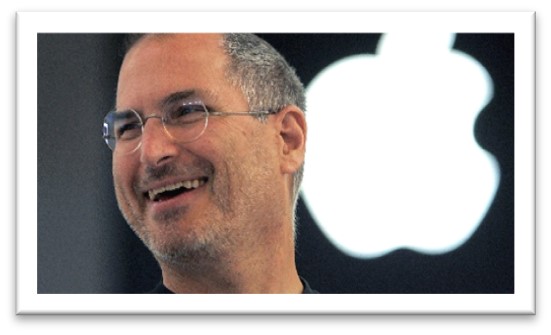 steve jobs smiling with apple logo behind him